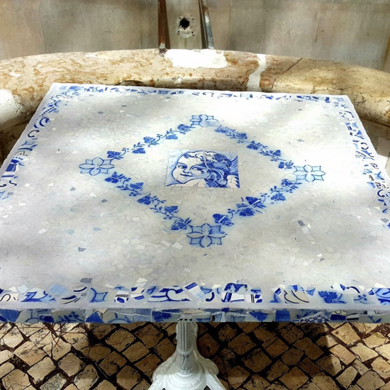 Picture of Portugal's ANGEL OF LUCK mosaic tabletop; antique tile mosaic tabletop; Portuguese tile mosaic tabletop; blue and white angel tabletop