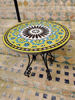 Handmade yellow and black mosaic table, reflecting Moroccan artistry, suitable for various decor styles.