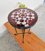 Handcrafted Moroccan mosaic table featuring vibrant colors and intricate patterns, suitable for indoor and outdoor use.