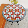 Handmade Moroccan tile table with colorful zellige patterns and a plant, ideal for adding charm to any indoor or outdoor space.