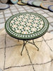A handmade Moroccan mosaic coffee table featuring a vibrant green and white patterned tile surface, suitable for indoor or outdoor use.