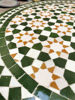 Customizable Moroccan mosaic coffee table with a green and white tile design, showcasing intricate craftsmanship for any space.