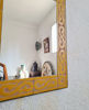 Decorative yellow mosaic wall mirror, highlighting handcrafted Moroccan tiles and suitable for various decor styles.