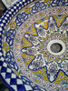 Close-up of a decorative Moroccan ceramic sink with a mandala design, emphasizing its handmade artistry and cultural heritage.