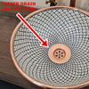 Elegant white ceramic bowl with a copper rim and faucet, showcasing a delicate fishscale pattern for a Moroccan touch.