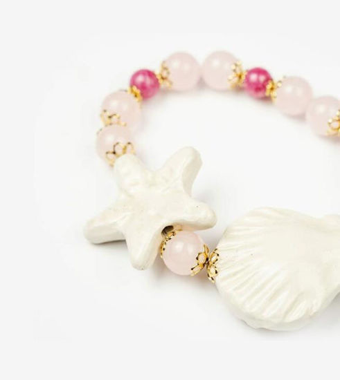 Picture of White star bracelet with gold, shell and rose quartz