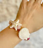 Picture of White star bracelet with gold, shell and rose quartz