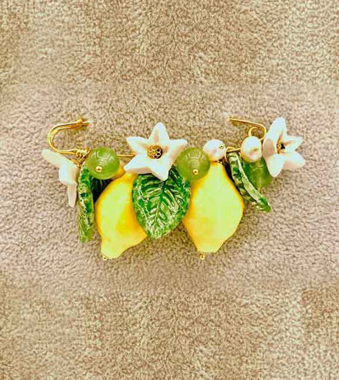 Picture of Gold plated brooch with ceramic lemon, leafs and natural stones.