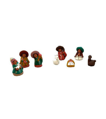 Handcrafted Mexican nativity scene with ceramic figurines showcasing folk art styles and cultural craftsmanship.