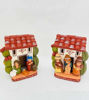 Hand-painted ceramic nativity scene set with two figurines: a house and a couple, reflecting traditional Peruvian artisan style.