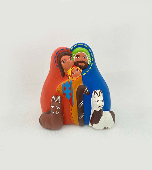 Vintage Peruvian nativity scene figurine featuring a donkey, sheep, and a man, handcrafted with traditional clay techniques.