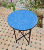 Elegant Zellige table with a sturdy black metal frame, placed on a patio, blending tradition and modern design.