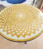 Elegant mosaic table with a yellow design, displayed against a wall, highlighting its customizable mid-century Moroccan style.