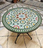 Customizable round Moroccan mosaic table showcasing colorful tile patterns, suitable for both indoor and outdoor settings.
