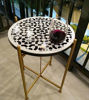Handmade Black & White Mosaic Table from Morocco in an indoor setting