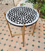 Handcrafted Moroccan Black & White Mosaic Table in a outdoor setting