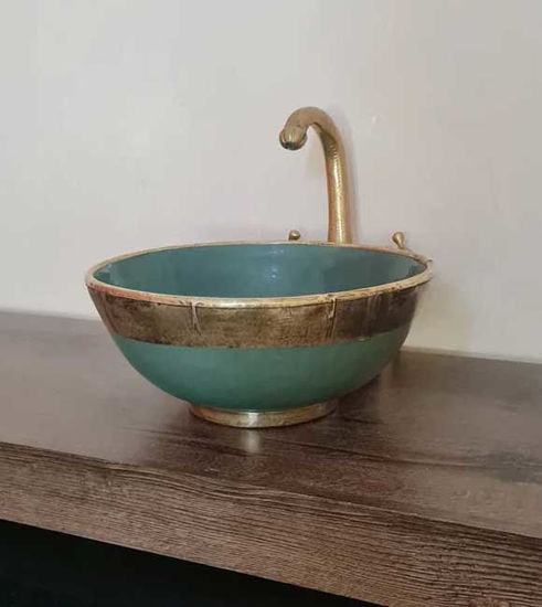 Emerald green ceramic bowl with gold faucet on a wooden counter, showcasing Moroccan fish scale design and artisan craftsmanship.