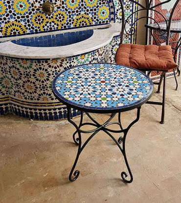Show details for Handmade Moroccan Mosaic Coffee Table – Blue Outdoor Bistro Table | Artisan Patio Furniture Colorful handmade Moroccan mosaic tile on a round coffee table, showcasing intricate blue patterns and artisan craftsmanship.