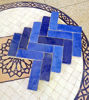 Handmade navy and royal blue Zellige terracotta tiles with a unique pattern, perfect for kitchens and bathrooms.