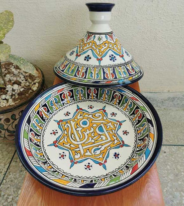 Colorful handmade Berber tagine and bowl with intricate designs, showcasing Moroccan ceramic artistry and vibrant glazes.