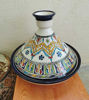 Handmade Moroccan tagine and bowl featuring colorful, intricate patterns, perfect for cooking and serving traditional dishes.