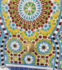 Handmade Moroccan wall fountain with vibrant blue and yellow mosaic tiles, adding rustic charm to gardens or patios.