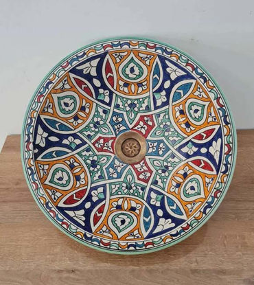 Colorful handmade Moroccan ceramic sink with intricate patterns, showcasing mid-century modern design.