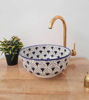 Unique blue and white ceramic bowl with sunflower motifs, reflecting traditional Moroccan craftsmanship and boho elegance.