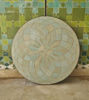 Handcrafted circular table with a flower pattern, made from Moroccan Zellige tiles in a natural sage color, perfect for any space.