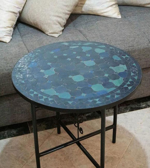 A handcrafted petrol blue mosaic table top featuring intricate geometric patterns, perfect for indoor or outdoor use.