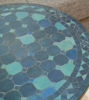 Elegant petrol blue mosaic table top with geometric designs, showcasing traditional Moroccan craftsmanship for versatile use.