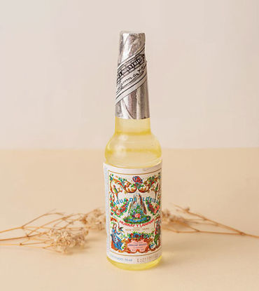 A labeled 70ml bottle of Florida Water cologne, promoting energetic cleansing and a refreshing aromatic experience.