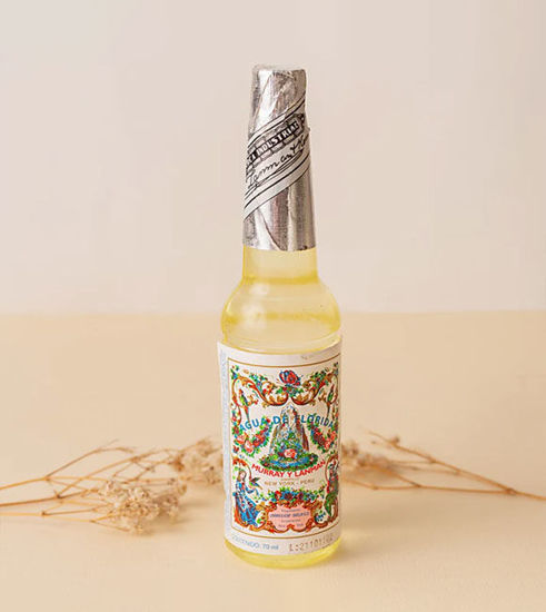 A labeled 70ml bottle of Florida Water cologne, promoting energetic cleansing and a refreshing aromatic experience.