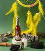 A beautifully packaged ritual kit featuring a dream catcher, cologne, candle, sage bundle etc. promoting spiritual healing and tranquility.