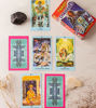 Tarot cards from the Shamans’ Tarot Deck are spread out on a table, showcasing Andean-inspired artwork and symbolism.