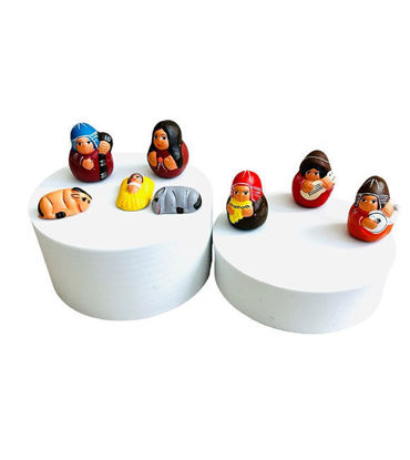 A set of 8 handmade Peruvian nativity scene figurines on a white box, each 1.5 inches, showcasing intricate hand-painted details.