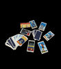 A collection of 78 vibrant tarot cards from the Radiant Rider-Waite Spanish Edition displayed on a black surface.