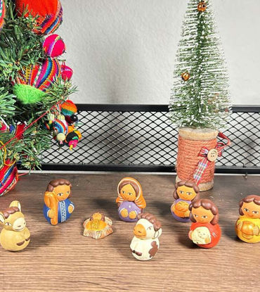 Vintage Peruvian nativity scene ornament set, featuring handmade clay figures of the Holy Family.