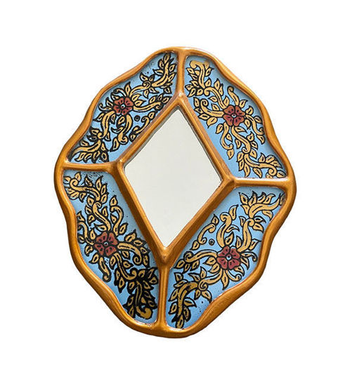 Handcrafted Peruvian-style decorative mirror with intricate floral carvings and gold leaf accents.
