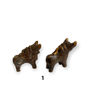 Two handmade Peruvian bull figurines, symbolizing protection and good fortune, with vibrant Andean designs and clay craftsmanship.