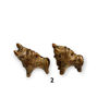 Set of two small Pucara bull figurines, hand-painted in bright colors, representing blessings and prosperity in Peruvian culture.