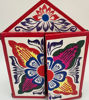 Colorful box featuring a flower design, representing vibrant Peruvian holiday folk art and traditional Andean culture.