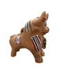 Small bull figurine with tribal patterns, handcrafted from clay, symbolizing protection and prosperity in Andean tradition.