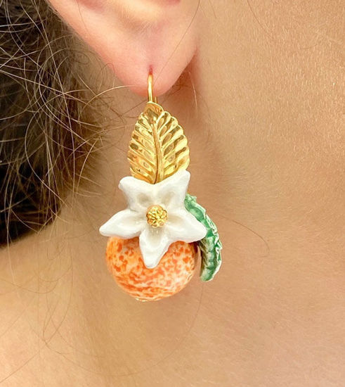Picture of Orange earrings with white flower and leaf