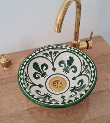 Dark green ceramic sink with a gold faucet, showcasing Mid Century Modern design and Moroccan craftsmanship.