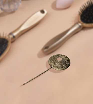 Handmade brass hairpin with a circular design, showcasing intricate detailing and a rustic finish, ideal for weddings and everyday wear.