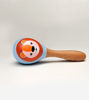 Eco-friendly wooden rattle toy shaped like a bear, crafted by artisans, with googly eyes to engage infants in sensory exploration.