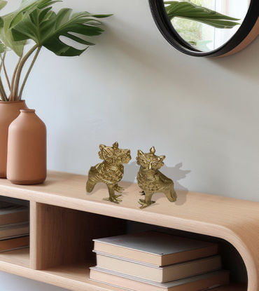 A pair of handcrafted brass Garuda figurines, symbolizing strength and protection in Indian culture.