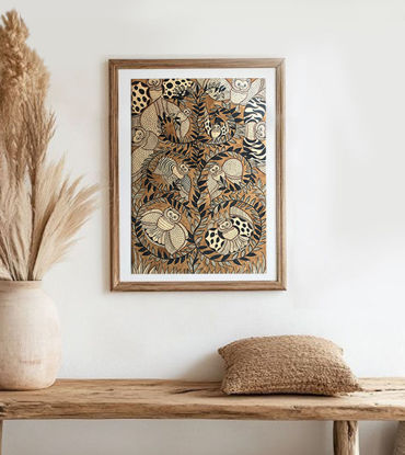 Traditional Bengal Patachitra art print framed on a wooden wall, featuring intricate wildlife scenes in earthy colors.