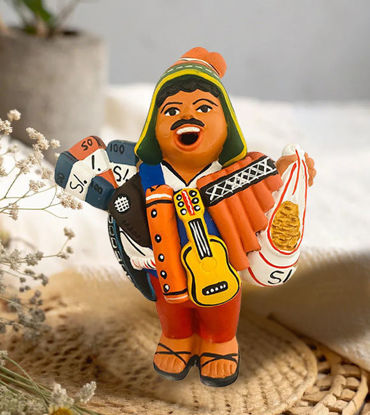 Ekeko Doll figurine, 7" tall, depicting a man with a guitar and bag, symbolizing abundance and good luck from Peru.